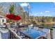 Outdoor dining area on the deck with lake views is perfect for entertaining and enjoying the natural surroundings at 1126 Wedgefield Sw Dr, Marietta, GA 30064
