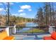 Enjoy the stunning lake views from this spacious deck with comfortable seating and picturesque scenery at 1126 Wedgefield Sw Dr, Marietta, GA 30064