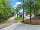 Attractive home with a circular driveway, landscaped front yard, and verdant surroundings at 1126 Wedgefield Sw Dr, Marietta, GA 30064