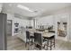 Spacious kitchen featuring white cabinets, granite countertops, stainless appliances, and a breakfast bar at 1126 Wedgefield Sw Dr, Marietta, GA 30064