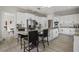 Spacious kitchen boasts white cabinets, granite countertops, stainless appliances, and a center island with seating at 1126 Wedgefield Sw Dr, Marietta, GA 30064