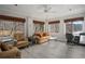 Cozy living room featuring comfortable seating, a ceiling fan, and large windows with scenic outdoor views at 1126 Wedgefield Sw Dr, Marietta, GA 30064