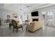 Spacious living room featuring a fireplace, ceiling fan, and windows providing ample natural light at 1126 Wedgefield Sw Dr, Marietta, GA 30064
