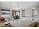 Bright living room offering wood-look floors, natural light, cozy seating, and tranquil lake views at 1126 Wedgefield Sw Dr, Marietta, GA 30064