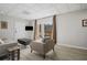 Bright living room features neutral walls, wood floors, recessed lighting, and access to the outdoors at 1126 Wedgefield Sw Dr, Marietta, GA 30064