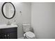 Stylish powder room with modern vanity, sleek mirror, and fresh fixtures, offers convenience and elegance at 1126 Wedgefield Sw Dr, Marietta, GA 30064