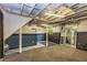 Unfinished basement area with painted walls, carpet flooring, exposed ductwork, and stairs to the upper level at 2191 Fairfield Se St, Smyrna, GA 30080