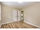 Bedroom with vinyl plank flooring, neutral colored walls, and white trim at 2191 Fairfield Se St, Smyrna, GA 30080