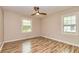 Bedroom with paneled accent wall, vinyl plank flooring, and natural lighting at 2191 Fairfield Se St, Smyrna, GA 30080