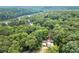 Overhead view of the home, nestled in a lush, green, mature forest, near a river at 225 Lakeview W Rdg, Roswell, GA 30076