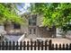 Backyard area with fire pit and seating, complemented by a charming home and landscaped features at 225 Lakeview W Rdg, Roswell, GA 30076