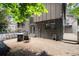 Charming backyard with a cozy fire pit area, complemented by a well-maintained home exterior and string lights at 225 Lakeview W Rdg, Roswell, GA 30076