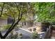 Landscaped backyard with gravel and mulch, showcasing a charming home with a patio and fire pit at 225 Lakeview W Rdg, Roswell, GA 30076