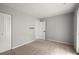 Bedroom featuring plush carpeting, neutral colors, and a closet at 225 Lakeview W Rdg, Roswell, GA 30076