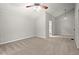 Bedroom with a ceiling fan, carpet, and ensuite bathroom entrance at 225 Lakeview W Rdg, Roswell, GA 30076