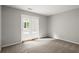 Cozy bedroom featuring carpeting and a double door entrance to an enclosed sunroom at 225 Lakeview W Rdg, Roswell, GA 30076