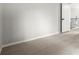 Empty bedroom featuring neutral colors, carpet, and an entry door to a hallway at 225 Lakeview W Rdg, Roswell, GA 30076