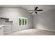 Upstairs bonus room featuring a ceiling fan, plush carpet, and a window with a view at 225 Lakeview W Rdg, Roswell, GA 30076