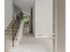 Open foyer featuring a staircase with a rod iron railing, leading to the upper level at 225 Lakeview W Rdg, Roswell, GA 30076