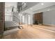 Open foyer with staircase, fireplace, and lots of natural light streaming in at 225 Lakeview W Rdg, Roswell, GA 30076