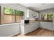 Updated kitchen with granite countertops, stainless microwave and ample natural light at 225 Lakeview W Rdg, Roswell, GA 30076
