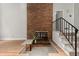 Living room with a brick fireplace and hardwood floors at 225 Lakeview W Rdg, Roswell, GA 30076