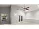 Spacious living room featuring high ceilings, a ceiling fan, and ample natural light from a window at 225 Lakeview W Rdg, Roswell, GA 30076