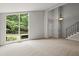 Open living room with vaulted ceilings, large windows, and modern lighting at 225 Lakeview W Rdg, Roswell, GA 30076