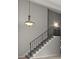 Modern staircase with sleek black railing and neutral carpet at 225 Lakeview W Rdg, Roswell, GA 30076