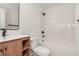 Bathroom with wood vanity, white countertop, and a shower-tub combo with a black shower head at 3473 Shoal Oak Ct, Riverdale, GA 30296