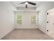 Bedroom with carpet, ceiling fan, and natural light from the windows at 3473 Shoal Oak Ct, Riverdale, GA 30296