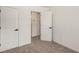 Cozy bedroom featuring neutral carpet, freshly painted walls, and a door leading to the closet at 3473 Shoal Oak Ct, Riverdale, GA 30296
