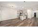 Open-concept kitchen featuring stainless appliances and stone countertops at 3473 Shoal Oak Ct, Riverdale, GA 30296