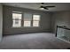 Bedroom featuring carpeted floor and multiple windows providing natural light at 6585 Story Cir, Norcross, GA 30093