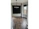 Dining area featuring dark hardwood floors and black window coverings at 6585 Story Cir, Norcross, GA 30093