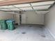 A spacious garage with ample overhead storage and green bins at 6585 Story Cir, Norcross, GA 30093