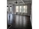 Spacious living room with dark hardwood floors and coffered ceilings at 6585 Story Cir, Norcross, GA 30093