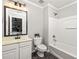 Bathroom featuring vanity, tiled floors, toilet and shower-tub combination at 732 Province Se Pl, Atlanta, GA 30312