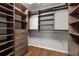 Spacious walk-in closet with custom shelving and drawers for optimal storage at 732 Province Se Pl, Atlanta, GA 30312