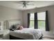 Cozy bedroom with a double bed, makeup desk and a large window at 107 Sedgefield Overlook, Dallas, GA 30157