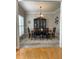 Traditional dining room with classic decor, featuring a wooden table set and ornate hutch at 107 Sedgefield Overlook, Dallas, GA 30157