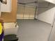 Spacious garage with epoxy flooring and ample storage space; perfect for car enthusiasts and organization at 107 Sedgefield Overlook, Dallas, GA 30157