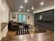 Open living area with bar seating, comfortable sectional, and bright natural light at 107 Sedgefield Overlook, Dallas, GA 30157