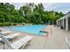Large community pool with plenty of lounge chairs and a play area, ideal for summer relaxation and fun at 107 Sedgefield Overlook, Dallas, GA 30157