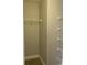 Empty walk-in closet with wire shelving at 107 Sedgefield Overlook, Dallas, GA 30157