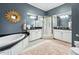 Large bathroom boasts a soaking tub, glass shower, dual sinks, and vanity at 1717 N Decatur Ne Rd # 322, Atlanta, GA 30307