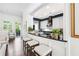 Open kitchen featuring bar seating, a dark countertop, and a view of the living room at 1717 N Decatur Ne Rd # 322, Atlanta, GA 30307
