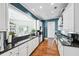 Modern kitchen with stainless steel appliances, black countertops, and white cabinets at 1717 N Decatur Ne Rd # 322, Atlanta, GA 30307