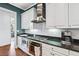 Well-equipped kitchen features white cabinets, granite countertops, and stainless steel appliances at 1717 N Decatur Ne Rd # 322, Atlanta, GA 30307