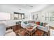 Open-concept living room offering stylish decor, a view into the kitchen, and plenty of natural light at 1717 N Decatur Ne Rd # 322, Atlanta, GA 30307